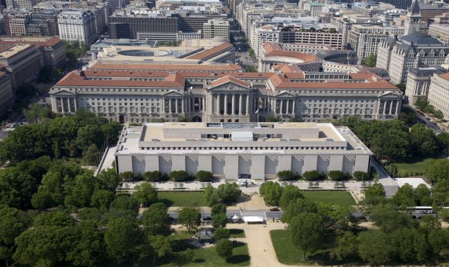 Aerial view of the Museum of Natural History and the Federal Triangle. The museum's collections total over 126 million specimens of plants, animals, fossils, minerals, rocks, meteorites, and human cultural artifacts. It is the second most popular of all of the Smithsonian museums and is also home to about 185 professional natural history scientists Ã the largest group of scientists dedicated to the study of natural and cultural history in the world.